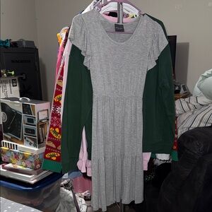 Grey flowy dress , hits a little above the knee for length.